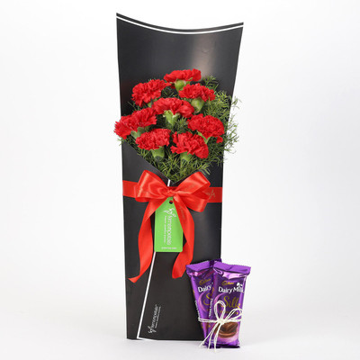 Ferns N Petals 8 Red Carnations Bouquet & Dairy Milk Silk Combo Combo(550gms)
