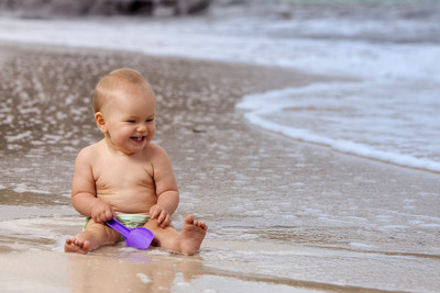 Child's Love - Cute Baby Playing at Sea shore Paper Print(12 inch X 18 inch, Streched)