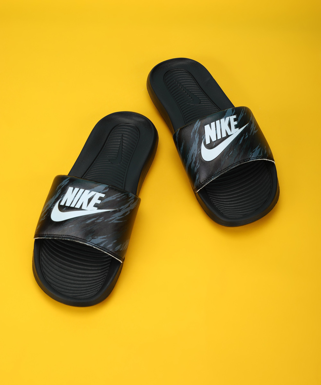 Yellow and black nike slides top