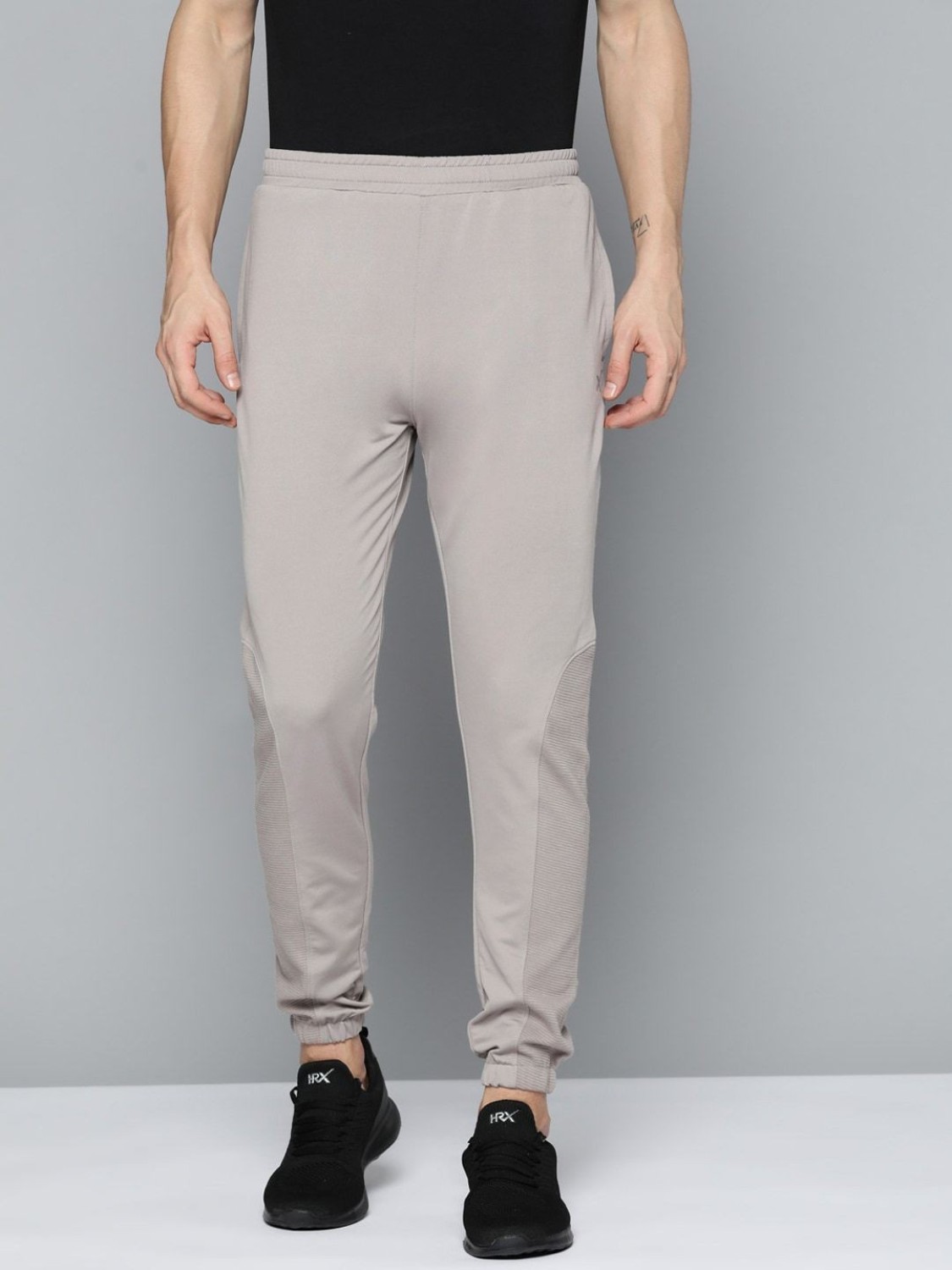 50 OFF on HRX by Hrithik Roshan Men Wet Weather Solid Slim Fit RapidDry  Lifestyle Track Pants on Myntra  PaisaWapascom