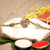 Religious Rakhi Gold Finish Chawal Roli Pack, Rakhi Set by Flipkart SmartBuy(1 Rakhi with Roli, Chawal)