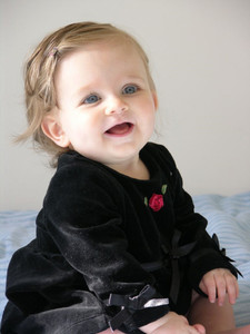 Cute baby girl in black dress on sale