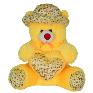 yellow teddy bear with cap