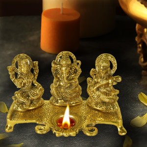 dreamkraft white metal gold plated lakshmi saraswati ganesh with deepak for pooja and festive decoration decorative showpiece  -  20 cm(gold finish, gold)