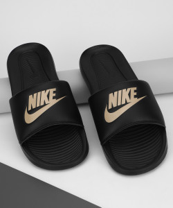 Gold and online black nike slides