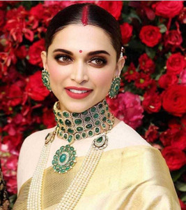 Red saree with new arrivals green jewellery