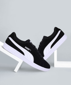 Puma black white sales shoes
