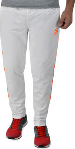 white and orange track pants