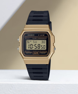 Casio gold and outlet black digital watch