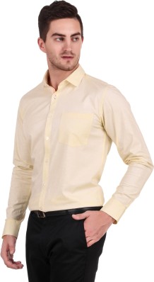 cream colour shirt and black pant