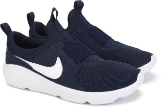 navy and white nike trainers