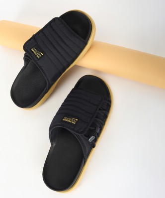 nike sliders with gold tick