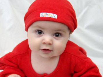 cute baby boy in red dress