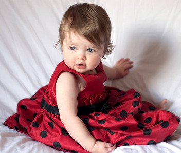 cute baby boy in red dress