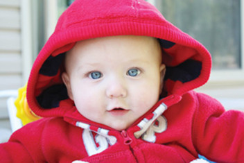 cute baby boy in red dress