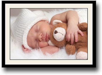 baby sleeping with teddy