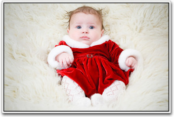 baby in red dress