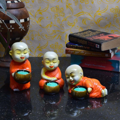 

eCraftIndia 3 Monks Polyresin 3 - Cup Tealight Holder Set(Orange, Brown, Pack of 3)