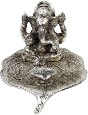 

Chesta Enterprises Lord Ganesha Pretty Pooja Idol in White Metal Iron Table Diya Set(Height: 7 inch)
