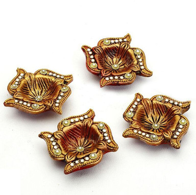 

Aapno Rajasthan Swastika With Gold Paint and Studded With Kundans Terracotta (Pack of 4) Table Diya Set(Height: 3 inch)