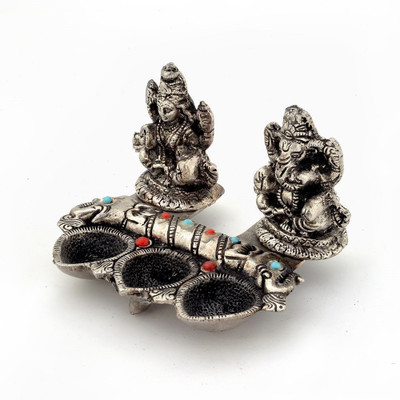 

Shree Sai Handicraft White Metal Lord Laxmi Ganeshas Set Silver Plated Table Diya(Height: 3.93701 inch)