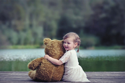 

RadhaKripa Cute baby and Teddy hug Poster Paper Print(18 inch X 12 inch, Rolled)