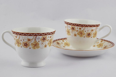 

Swagger Elegant fine bone china tea set or cup and saucer set with golden yellow designer flowers Bone China(Multicolor, Pack of 12)