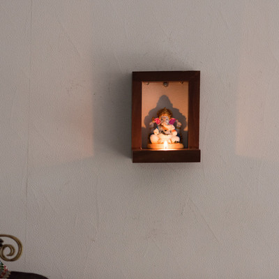 

eCraftIndia Lord Ganesha Under Wooden Wall Hanging Mandir having Tea-Light Holder Decorative Showpiece - 15 cm(Wooden, Multicolor)