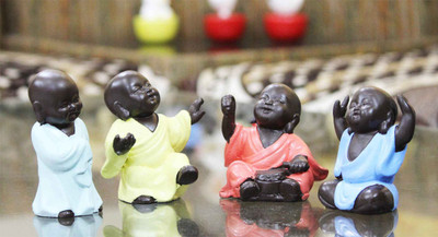 

Craft Junction Set of 4 Elegant Look Little Baby Monk Child Decorative Showpiece - 11 cm(Polyresin, Multicolor)