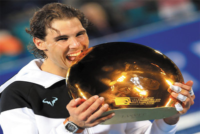 

rafael-nadal-bites-trophy Poster Paper Print(18 inch X 12 inch, Rolled)