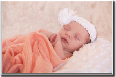 

Cute sleeping baby in orange Print Poster on 13x19 Inches Paper Print(19 inch X 13 inch, Rolled)