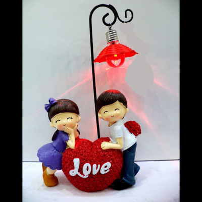

Anant Gift Gallery LOVE COUPLE WITH 3D LIGHT Decorative Showpiece - 25 cm(Ceramic, Multicolor)