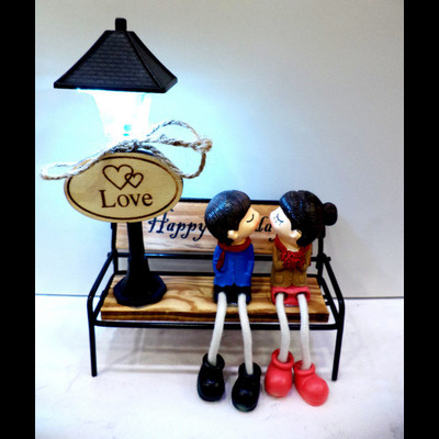

Anant Gift Gallery ROMANTIC LOVE COUPLE WITH 3D LIGHT Decorative Showpiece - 17 cm(Wooden, Polyresin, Multicolor)