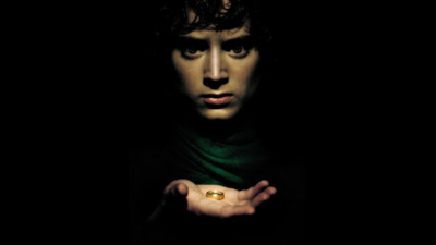 

Aabhaas movies-the-lord-of-the-rings-the-lord-of-the-rings-the-fellowship-of-the-ring-frodo-baggins-elijah-wood Wall Poster Paper Print(12 inch X 18 inch, Rolled)