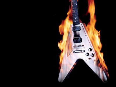 

music-guitar-fire-johnzbringquez-yahoo-com-raskgytr Wall Poster Paper Print(12 inch X 18 inch, Rolled)