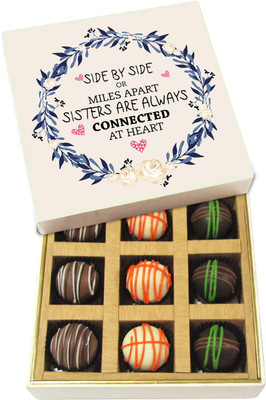 

Chocholik Rakhi Gift Box - Sisters Are Always Connected by Heart - Dark, Milk, White Chocolate Truffles - 9pc Truffles(135 g)