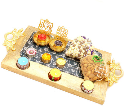 

Ghasitaram Gifts Dryfruits hamper-Big Wooden Serving platter with Shadow Laxmi Ganesha T-lite, 6 t-lites, Almonds and nutties Pouches Combo(11)