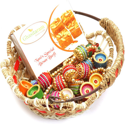 

Ghasitaram Gifts Hampers-Jute Cane Basket with Nani's Special Besan Barfi, Toran and Diyas Combo(9)
