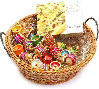 

Ghasitaram Gifts Hampers-Big Cane Basket Basket with Soan Papdi, Toran and Diyas Combo(9)