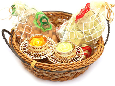 Ghasitaram Gifts Hampers-Small Cane Basket with Almonds, Chocolate Pouches and 2 T-Lites Combo(5)