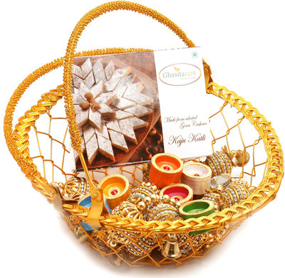

Ghasitaram Gifts Hampers-Golden Metal Basket Basket with Kaju Katli, Toran and Diyas Combo(9)