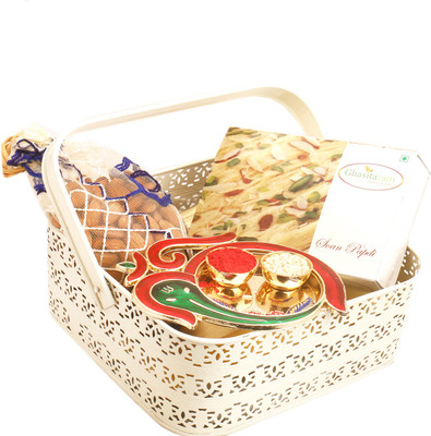 

Ghasitaram Gifts Hampers-White Metal Basket with Soan Papdi, Almonds Pouch and Om Ganesh Pooja Thali Combo(4)