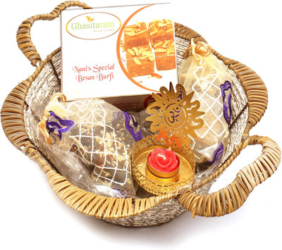 

Ghasitaram Gifts Hampers-Brown Basket with Nani's Spl Besan Barfi, English brittles Chocolates, Roasted Almond Bites Pouch with Om T- Lite Combo(5)