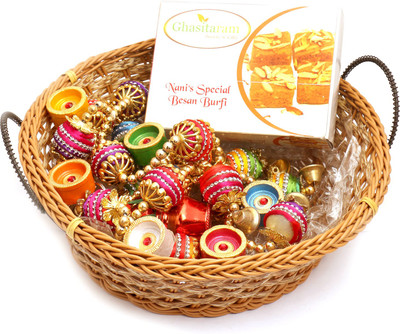 

Ghasitaram Gifts Hampers-Big Cane Basket Basket with Nani's Special Besan Barfi, Toran and Diyas Combo(9)