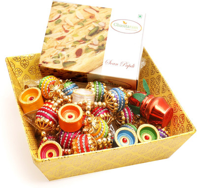 

Ghasitaram Gifts Hampers-Yellow Basket with Soan Papdi, Toran and Diyas Combo(9)