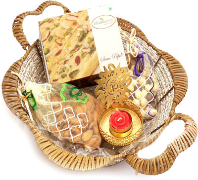 

Ghasitaram Gifts Hampers-Brown Basket with Soan Papdi, Almonds, Nutties Pouch with Om T- Lite Combo(5)