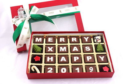 

Zoroy Luxury Chocolate Christmas Box with the message "Merry X mas and Happy 2019" written on milk chocolate Fudges(300 g)