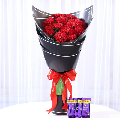 

Ferns N Petals Beautiful 12 Red Carnations & Dairy Milk Combo Combo(550gms)