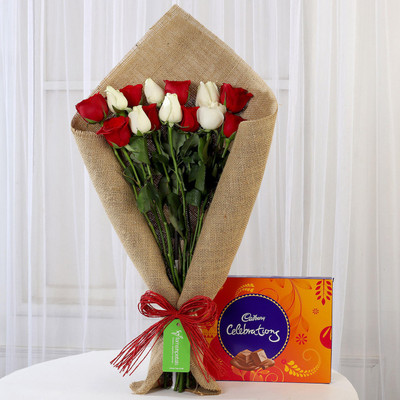 

Ferns N Petals Red & White Roses with Cadbury Celebrations Combo(550gms)