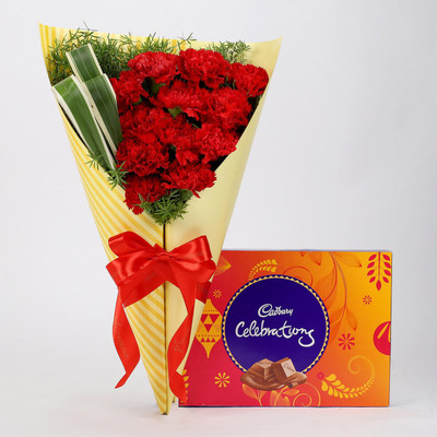 

Ferns N Petals 12 Red Carnations & Celebrations Box Combo(550gms)